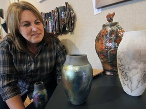 Potter Deb Beard shows off several pieces which are included in the Painters and Potters Show at the Tillsonburg Station Arts Centre, including her very own version of ‘hairy pottery’, horsehair Raku, at the far right. Jeff Tribe/Tillsonburg News