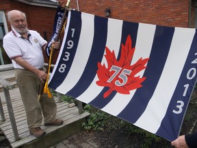 Larry (left) and Joan Hicks were thrilled to take possession of one of the Canadian Power Squadron’s 75th Anniversary flags for a day, on behalf of the Tillsonburg Power and Sail Squadron. This flag, and its twin, began cross-Canada voyages on May 5, and will be reunited in Toronto on October 26 as the culmination of 75th anniversary celebrations. Jeff Tribe/Tillsonburg News