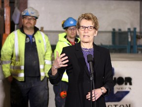 Ontario Premier Kathleen Wynne speaks to the media at Anchor Concrete in Kingston on Tuesday. (Ian MacAlpine The Whig-Standard)