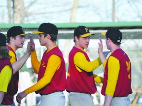 The Trojans celebrate a win during their doubleheader against WC Miller on May 14. (Kevin Hirschfield/THE GRAPHIC/QMI AGENCY)