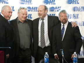 OHL Commissioner David Branch, left, joins London Knights head coach Dale Hunter, general manager Mark Hunter and governor Trevor Whiffen after announcing Tuesday that London will host the 2014 Memorial Cup. (CRAIG GLOVER The London Free Press)