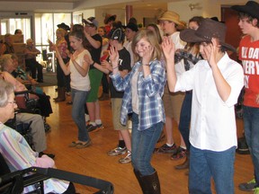 Grade 8 students at Monsignor O'Neil Catholic School visited their Grandfriends at the Maple Manor Home in Tillsonburg recently. The Grandfriends were entertained as students performed their Dancefest dance, stomping and twirling to the catchy tunes. A lovely chat and snack followed, on a beautiful day for a visit. Contributed Photo Courtesy of Jennifer Van Acker-Barlow