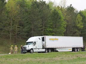 Brant firefighters were called out to the eastbound Highway 403 west of Oak Park Road Tuesday evening to help a truck driver out of the vehicle, which appeared to have collided with something that damaged its front bumper and a tire. MICHAEL PEELING/The Paris Star/QMI Agency