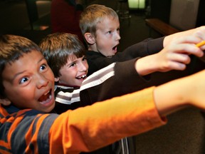 Grade 4 students react to one of the exhibits when Body Worlds visited the Telus World of Science in 2008. File Photo/QMI Agency