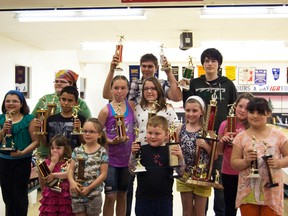 Members of the Youth Bowling Club show off the awards they received on May 6 at the Unchaga Lanes and Lounge Annual Awards Ceremony.