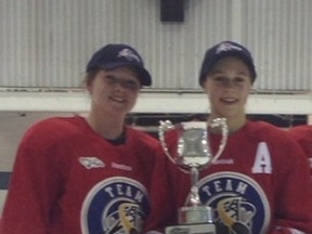 Madison Bjornson (left) and Rachel Paul (right) celebrate as their North Red Wings defeated the South Coyotes 2-1 on May 5 to win the 2013 ATB Alberta Challenge.