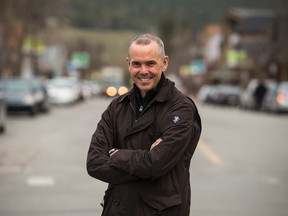 James Kendal stands on Canmore's Main Street. The Canmore resident and avid cyclist is the chairperson for the Canmore organizing committee for the Tour of Alberta cycling race, which will race through the community on Sept. 7, 2013. Justin Parsons/ Canmore Leader/ QMI Agency