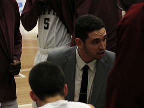 Eric Magdanz talks to MacEwan Griffins men’s basketball players during a game last season. Photo supplied.