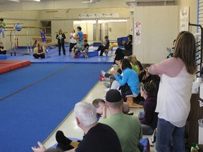 Friends and family gather to watch the Wednesday Boys gymnastics class
show off their skills.