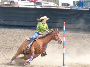 Miranda Giesbrecht rounds the first pole in pole-bending competition during the Worsley High School Rodeo held May 11-12 in Worsley, finishing with a 22.951 time.