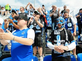 FC Edmonton Supporters Group members chant the “Eddies” to victory as FC Edmonton dispatched the Atlanta Silverbacks 3-0 at Clarke Stadium last weekend. TREVOR ROBB Edmonton Examiner