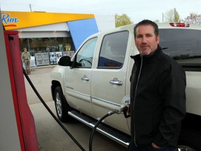Mike Shannon fills up at the Esso gas bar on Algonquin Avenue, Wednesday, May 15, 2013. Gasoline prices have been fluctuating from a low of $1.039 a litre to $1.299 a litre over the last few weeks in the city.