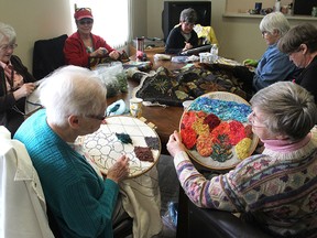 Members of the Limestone Loopers rug hooking group, including Lena Dunn, front left, and Heather Buchan, front right, meet for their weekly hooking session.
Michael Lea The Whig-Standard