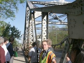 Nathan Holth (facing camera) led a tour of the Victoria Road Bridge south of Thamesville.