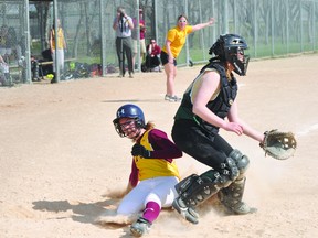 Kaelyn Taylor slides into home during a PCI Saints doubleheader Wednesday afternoon. The Saints defeated Sanford 5-2 and W.C. Miller 6-2 to finish the regular season at 5-1. (Kevin Hirschfield/THE GRAPHIC/QMI AGENCY)