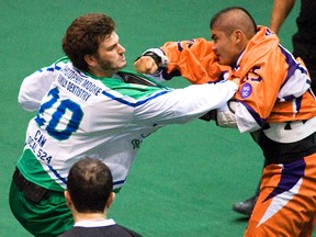 Danny Vyse (right) of the Arrows, shown fighting Peterborough’s Paxton Leroux last season, has taken a leadership role this season. (QMI file photo)