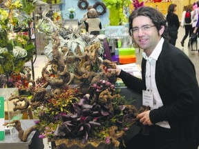 Paul Zavitz, of the Toronto Botanical Garden, says succulents, such as these growing in a driftwood arrangement at Canada Blooms, make great container plants because of their drought resistance and minimal care. Planters generally need daily watering. (Photo by Claus Andersen Special to The Free Press)