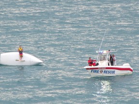 Two young men were rescued on Lake Huron Wednesday evening after their small sailboat capsized. (Submitted photo)