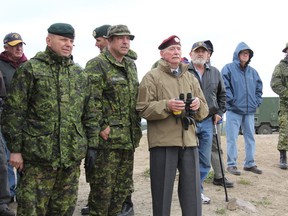 SEAN CHASE   Master Warrant Officer Mark Cushman (second from left) explains a platoon live fire attack to Korean veteran Donald W. Tremblay (centre) while Lt.-Gen. Walt Semianiw, commander of Canada Command, looks on. Members of the Royal Canadian Regiment marked the 60th anniversary of the Battle of Hill 187 Wednesday at CFB Petawawa.