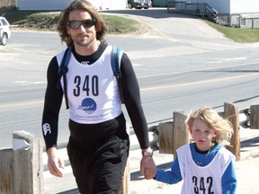 David Kyle and his five-year-old son Liam walk in the 5 km race for the Mother’s Day Charity Road Race in Kenora. The race saw a huge 305 participants walk and run down Lakeview Drive on Sunday, May 12.