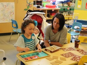 Leia Calaiezzi, 6, works on a matching game in the senior kindergarten room.