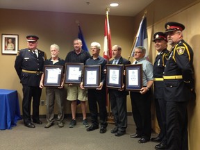 Recipients of the Chief's Citation award in Owen Sound pose for a picture. Michael Lemme is the fourth person from the left. (DENIS LANGLOIS)