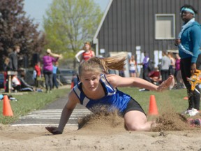 Rayna Moore stretches it out in the midget girls triple jump competition at the Huron Perth Track and Field championships held at GDCI May 14-15. Athletes competed in frigid conditions on the opening day but the sun came out for the second day. Moore finished second in her event, a day after winning the long jump. More photographs of the H-P championships will appear in the May 22 Goderich Signal Star.