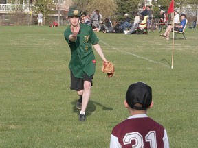 Tyler Mathieu of the Sherwood Park Midget AAA Dukes lobs a ball to a minor league player as the Dukes got out for a grassroots day of baseball with the kids at McPherson Park on Wednesday. Photo by Shane Jones/Sherwood Park News/QMI Agency