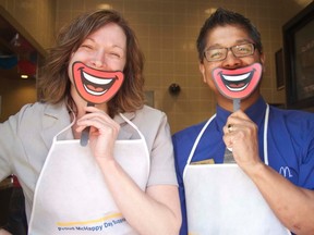 Times sales representative Roxanne Mackintosh and McDonald’s manager Fred Parafina share a McHappy smile during McHappy Day, May 8.