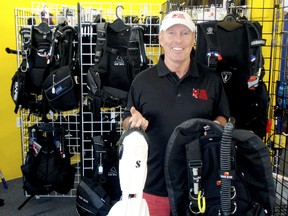 Gary Smith, owner of Red Devil Scuba in Chatham, On. has accomplished many firsts during his 20-year career in the dive industry. Smith is shown here on May 16, 2013, in his St. Clair Street dive shop with some of the latest equipment. BOB BOUGHNER/ THE CHATHAM DAILY NEWS/ QMI AGENCY