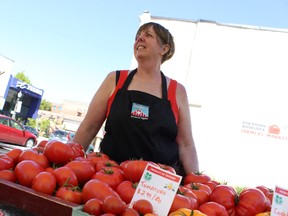 Sue Hilborn, of Red Barn berries and veggies, said she had a good turnout and enjoyed the beautiful weather on Thursday afternoon for the first Downtown Farmers Market of the season in Museum Square. The market will be held every Thursday from now until the end of the summer. 
CODI WILSON/ Sentinel-Review