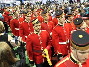 Walking into Thursday's convocation ceremony between rows of families and friends, graduating cadets from the Royal Military College prepare to receive their university degrees.
Michael Lea The Whig-Standard