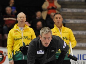 Glenn Howard and teammate Wayne Middaugh watch over the shoulder of Skip Joe Frans during curling action at the 2013 Dominion Tankard in Barrie. Howard's rink has won the event, which is coming to Smiths Falls in 2014, the past eight years. (MARK WANZEL QMI)