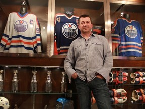 Shawn Chaulk shows off the main attraction of his enormous collection of Wayne Gretzky memorabilia in his basement. With the largest collection of the Great One's game worn equipment and other mementos, Chaulk is putting a number of his one-of-a-kind items up for auction beginning Friday. JORDAN THOMPSON / TODAY STAFF