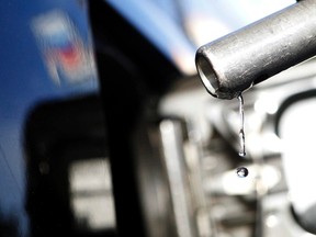 Gasoline drips off a nozzle during refuelling at a gas station.   REUTERS/Mario Anzuoni/Files