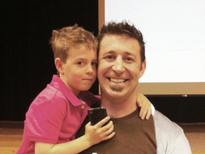 Jim Moss and his son Wyatt. Jim spoke at Saugeen District Secondary School on May 7 about the importance of being happy. He created the organization called the Smile Epidemic, and spoke at the school as a part of mental health month.