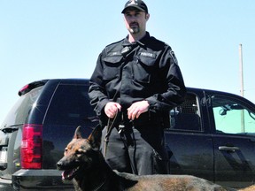 Brockville Police Service Constable Jeff Rean poses with new police canine Chase. (ALANAH DUFFY/The Recorder and Times)