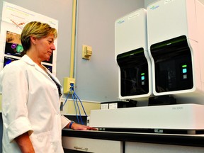 Ruby Locke, the charge technologist for hematology at Brockville General Hospital, stands with the hospital's new Sysmex XN-2000 automated hemotology analyzer. The machine at Brockville General Hospital is the first of this model to be dispensed in Canada. (ALANAH DUFFY/The Recorder and Times)