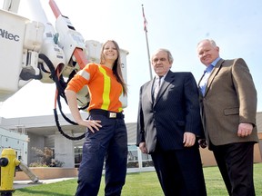 Kendra Serecin, will be the first woman to graduate from the two-year powerline technician program and attend the powerline apprenticeship program after Dr. John Strasser, center, St. Clair College president, and Al Beattie, president and CEO of Infrastructure Health and Safety Association signed a three-year agreement for a training site at St. Clair College Thames Campus Friday. DIANA MARTIN/ THE CHATHAM DAILY NEWS/ QMI AGENCY