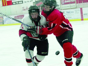 A decision by Hockey Canada to remove bodychecking from the peewee level has created a large debate across Canada. Peewee players in a playoff game in Whitecourt March 2012.