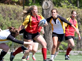 Sydenham Golden Eagles’ Becky Hill carries the ball against the La Salle Black Knights during the Kingston Area Secondary Schools Athletic Association girls rugby championship game on Friday at Nixon Field. The Golden Eagles won 7-3. (Ian MacAlpine/The Whig-Standard)