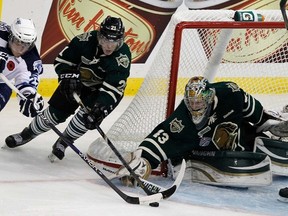 London Knights Anthony Stolarz makes the save on Michael Ferland of the Saskatoon Blades during the 2013 MasterCard Memorial Cup in Saskatoon. (Al Charest, QMI Agency)