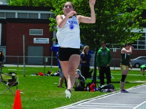 Kasey Andrews of the TISS Pirates goes airborne during junior girls long jump action at the LGSSAA track and field championships on Friday at Thousand Islands Secondary School. Andrews won the event. STEVE PETTIBONE The Recorder and Times