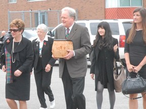 Diane Finley, federal Human Resources Minister and MP for Haldimand-Norfolk, far left, arrives at a memorial service Saturday in Port Dover for her late husband Senator Doug Finley, who died May 11.  (SARAH DOKTOR Simcoe Reformer)
