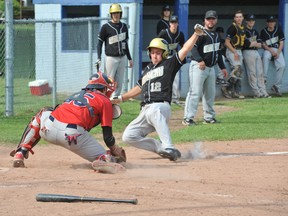 Brockville Bunnies catcher Mitch Doucette stops L'Attak de Gatineau's Cedrik Pellerin from scoring the tying run in sixth-inning action during game two of Saturday's doubleheader at Fulford Park. The Bunnies swept the season-opening doubleheader 7-1 and 5-4. RONALD ZAJAC The Recorder and Times