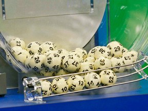 The winning Powerball numbers are shown after being drawn at the Florida Lottery studio in Tallahassee May 18, 2013. The winning numbers are 22, 10, 13, 14, 52, and the Powerball number is 11. The Powerball jackpot is a record-setting $590.5 million. (REUTERS/Philip Sears)
