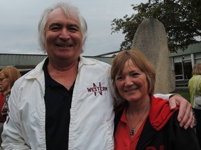 Stewart Hill, with wife Kathy, sports a genuine 1967 Northwestern Secondary School jacket at the open house to celebrate the school's 50th anniversary. (Cutline-LAURA CUDWORTH, The Beacon Herald)