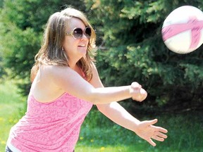 Susie Beehler of Mitchell delivers a serve at Wildwood Conservation Area Sunday. (LAURA CUDWORTH, The Beacon Herald)
