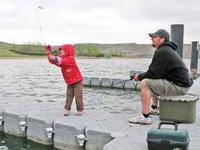 Despite a forecast calling for a weekend of rain, not much came down, although the skies remained overcast in Vulcan County, including the Little Bow Provincial Park. While some people packed it in and headed home on Sunday, many others wanted to make the most of the camping season’s first long weekend. Here, dad Rick Noll watches as Paityn, 3, casts from the Little Bow Provincial Park boat launch on Sunday, May 19.