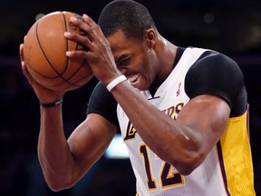 Los Angeles Lakers centre Dwight Howard (12) reacts after being fouled by the San Antonio Spurs during Game 4 of their NBA Western Conference quarterfinal basketball playoff series in Los Angeles, April 28, 2013.  (REUTERS)